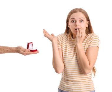 Nervous young woman get proposed on white background