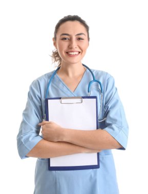 Female medical assistant with clipboard on white background