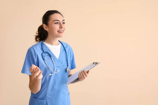Female Medical Assistant Clipboard Beige Background — Foto Stock