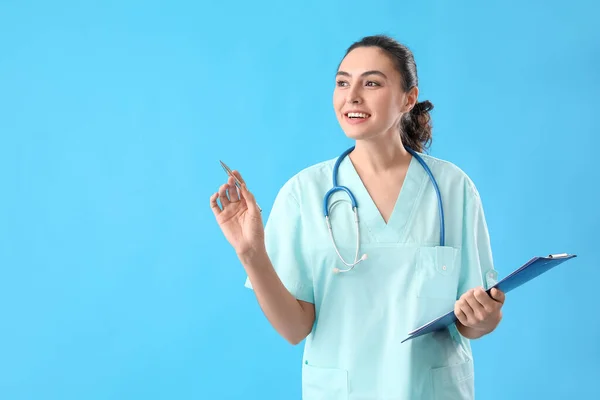 Female Medical Assistant Clipboard Light Blue Background — Stockfoto