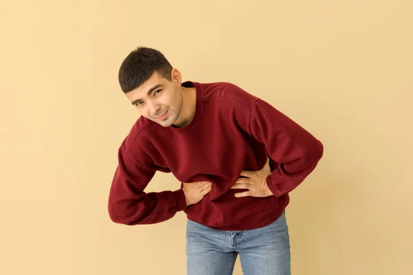 Young Man Appendicitis Beige Background — Fotografia de Stock