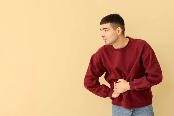 Young Man Appendicitis Beige Background — Stok fotoğraf