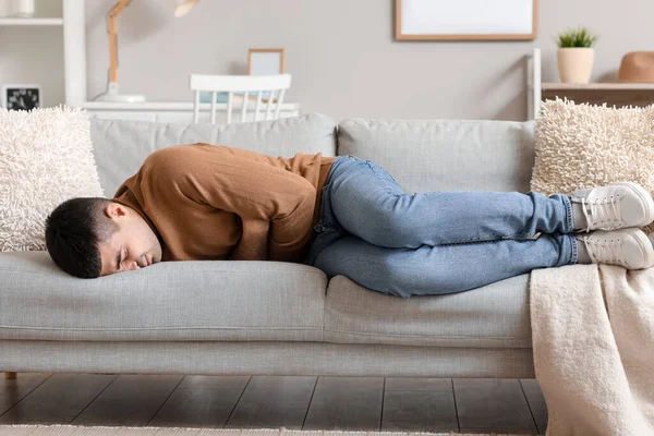 Young Man Appendicitis Lying Sofa Home — Stock Photo, Image