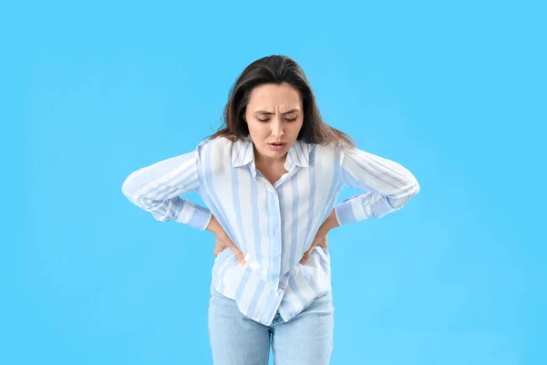 Young Woman Abdominal Pain Blue Background — Stock Photo, Image