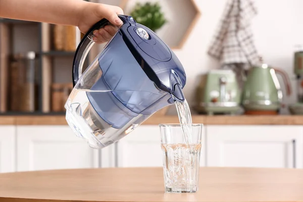Woman Pouring Water Modern Filter Jug Glass Table Kitchen — Stock Photo, Image