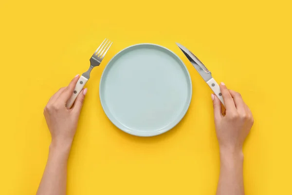 Woman Cutlery Empty Plate Yellow Background — Stock Photo, Image