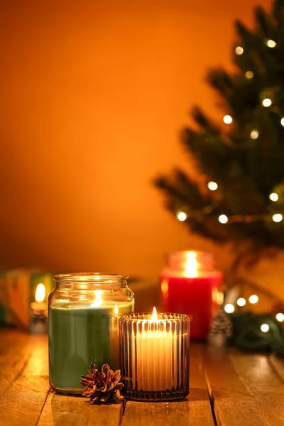 Burning Candles Fir Cone Dark Wooden Table Closeup — Stock Photo, Image