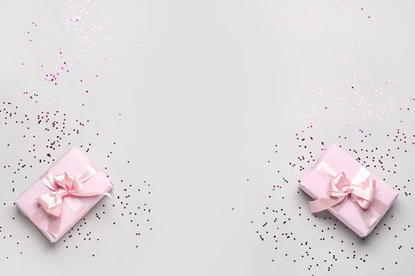 Gift Boxes Beautiful Bows Confetti Grey Background — Stock Photo, Image