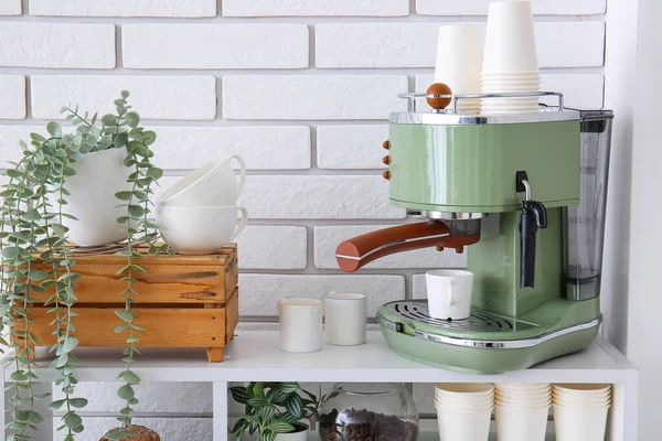 Modern Coffee Machine Cups Houseplants Shelving Unit White Brick Wall — Stock Photo, Image