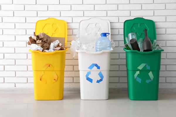 Trash Bins Recycling Symbol Different Garbage White Brick Wall — Stock Photo, Image