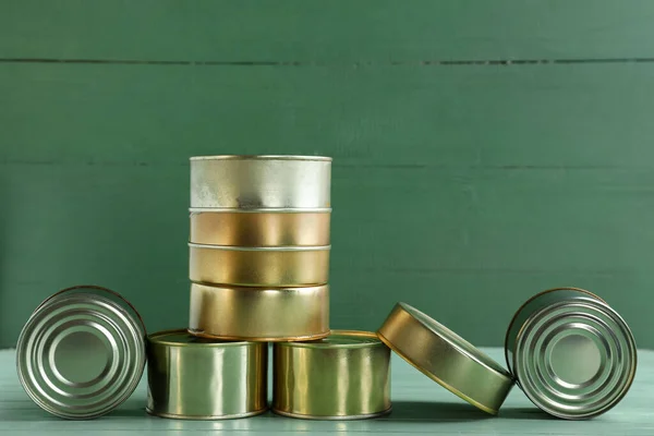 Different Tin Cans Fish Green Wooden Table — Stock Photo, Image