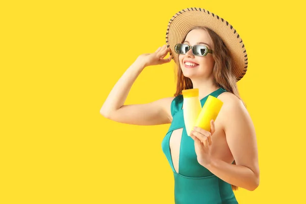 Beautiful Young Woman Sunscreen Creams Yellow Background — Stock Photo, Image