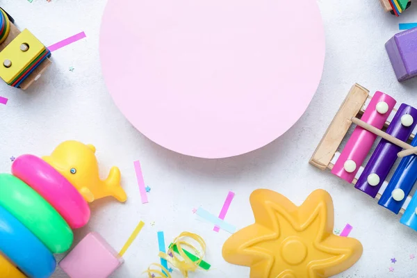 Stock image Composition with blank card and different toys on white table. Children's Day celebration