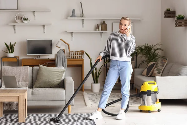 Young Woman Vacuum Cleaner Talking Mobile Phone Home — Stock Photo, Image