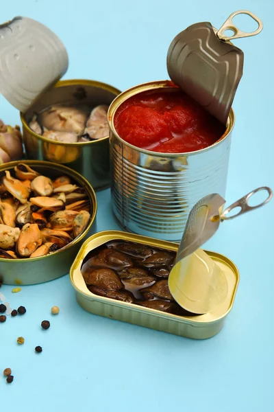 Opened Tin Cans Mussels Tomato Sauce Blue Background — Stock Photo, Image