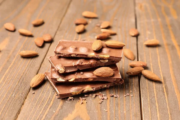 Sweet Tasty Chocolate Nuts Wooden Background — Stock Photo, Image