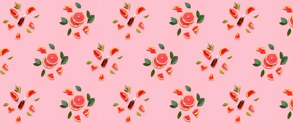 Muitas Garrafas Óleo Essencial Toranja Fundo Rosa Padrão Para Design — Fotografia de Stock