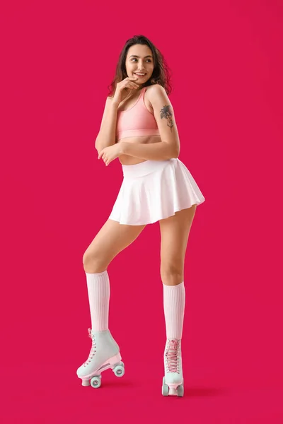 Young Woman Roller Skates Pink Background — Stok fotoğraf
