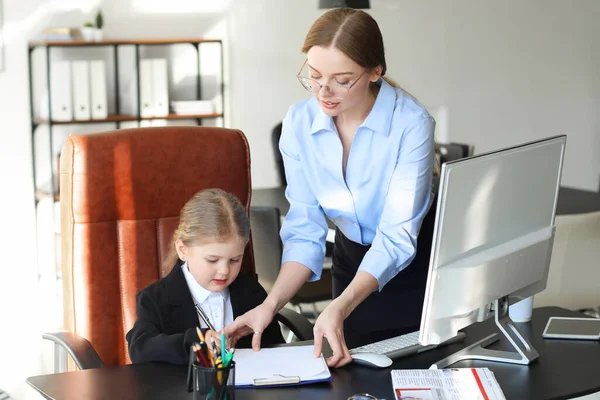 stock image Funny little businesswoman working with her secretary in office