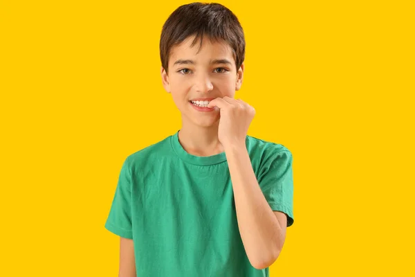 Little Boy Biting Nails Yellow Background — Foto de Stock