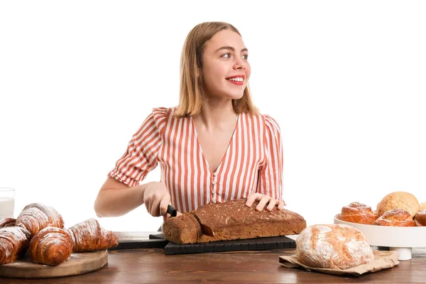 Female Baker Cutting Fresh Bread Table White Background — Zdjęcie stockowe