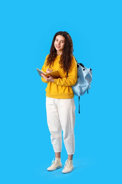 Female Student Notebook Backpack Blue Background — Zdjęcie stockowe