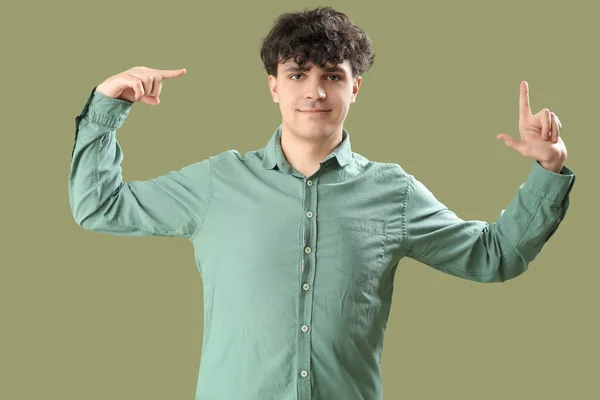 Young Man Showing Loser Gesture Green Background — Stock Photo, Image