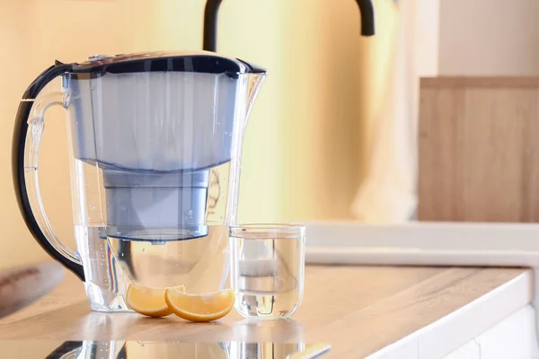 Modern Filter Jug Glass Water Lemon Pieces Kitchen Counter — Stock Photo, Image
