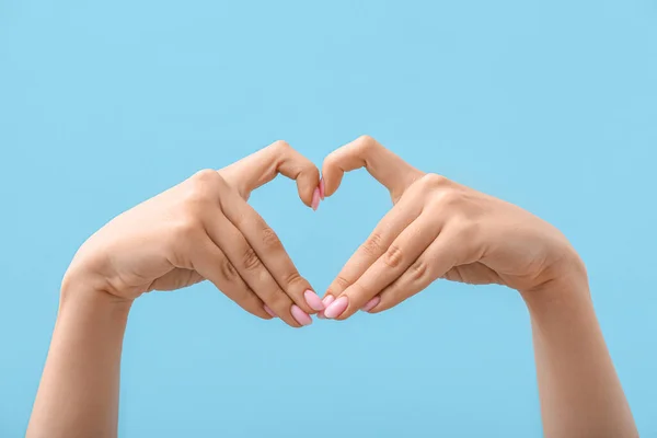 Woman Making Heart Her Hands Blue Background — Stock Photo, Image