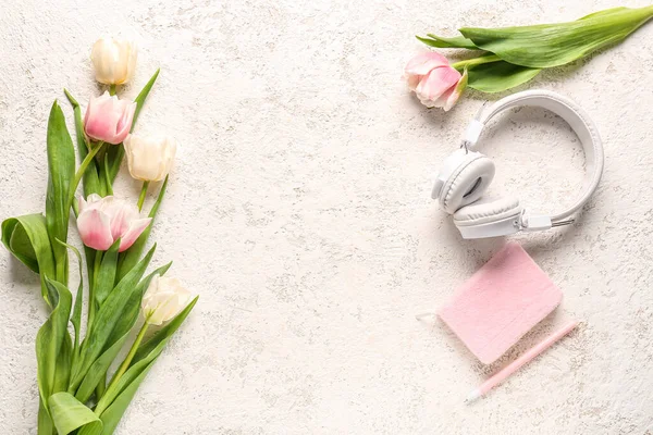 Modern Headphones Notebook Beautiful Tulip Flowers Light Background — Stock Photo, Image