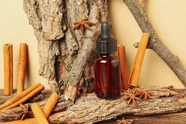 Bottle Essential Oil Cinnamon Sticks Anise Tree Barks Table Beige — Stock Photo, Image