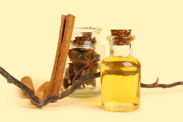 Bottle Essential Oil Cinnamon Sticks Anise Tree Branch Background — Stock Photo, Image