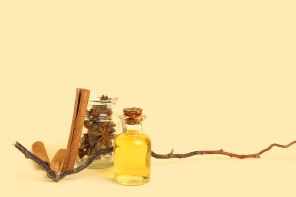 Bottle Essential Oil Cinnamon Sticks Anise Tree Branch Background — Stock Photo, Image