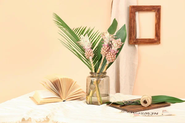 Vase Decorative Pineapples Palm Leaves Book Rope Table Beige Wall — Stock Photo, Image