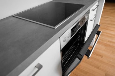 Modern electric oven in light kitchen