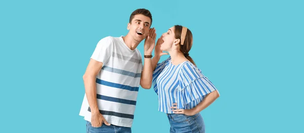 Young Woman Sharing Gossip Her Boyfriend Light Blue Background — Stock Photo, Image