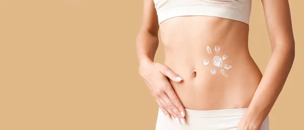 Young Woman Sunscreen Cream Her Belly Beige Background Closeup — Stock Photo, Image