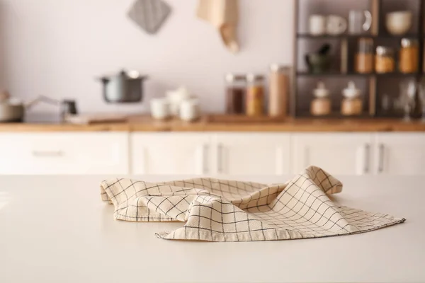 stock image Checkered napkin on table in modern kitchen