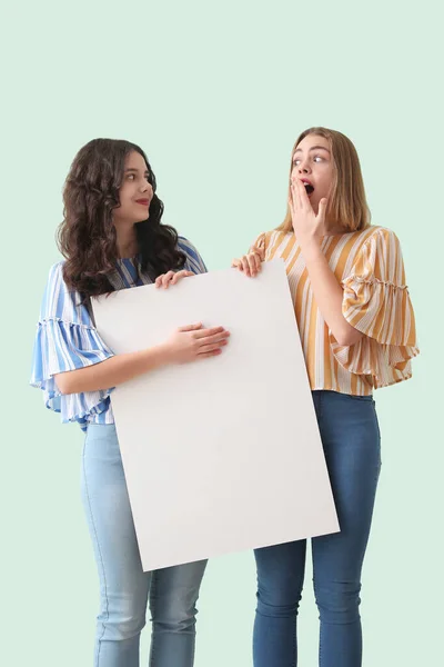 Young Women Big Blank Poster Mint Background — Stock Photo, Image
