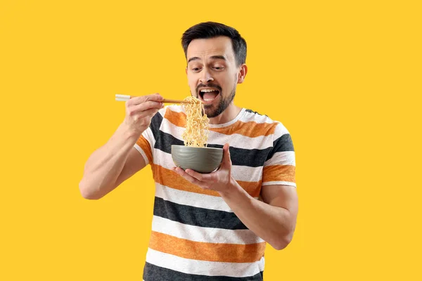 Handsome Man Bowl Chinese Noodles Yellow Background — Fotografia de Stock
