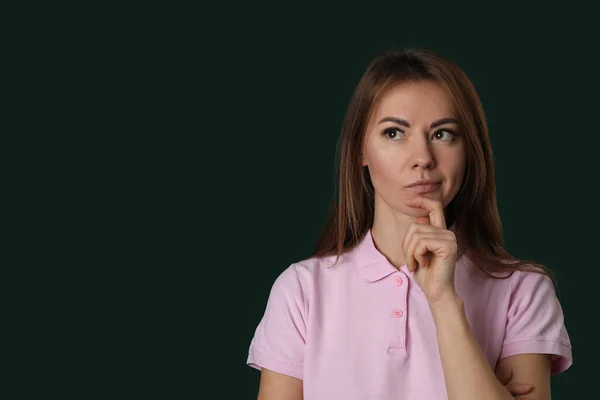 Thoughtful Young Woman Pink Shirt Green Background — Stock Photo, Image