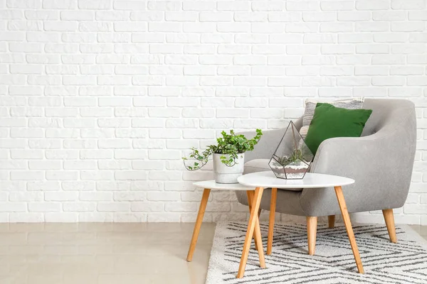 Cozy Grey Armchair Cushions Houseplants Tables White Brick Wall — Stock Photo, Image