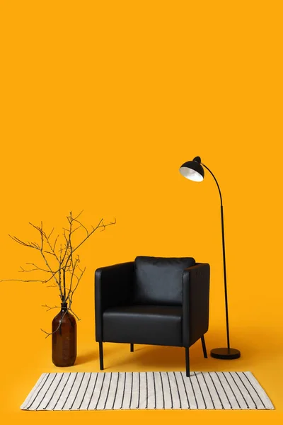 Modern Black Armchair Lamp Vase Branches Orange Background — Stock Photo, Image