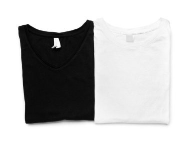 Folded stylish t-shirts on white background clipart