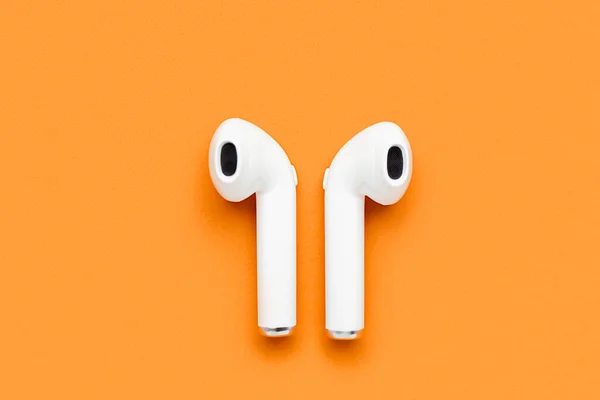 Modern White Earphones Orange Background — Stock Photo, Image