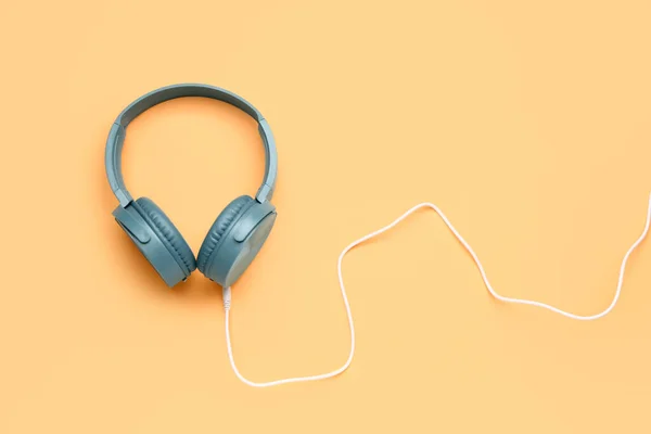 Modern Blue Headphones Beige Background — Stock Photo, Image