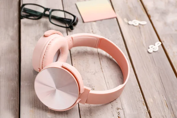 Modern Pink Headphones Eyeglasses Grey Wooden Background — Stock Photo, Image