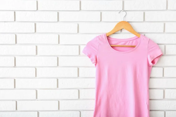 Pink Shirt Hanging White Brick Wall — Stock Photo, Image