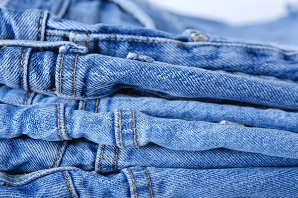 Gefaltete Jeans Als Hintergrund Nahaufnahme — Stockfoto