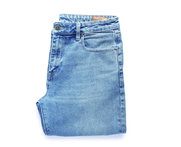 Calça Jeans Dobrada Sobre Fundo Branco — Fotografia de Stock
